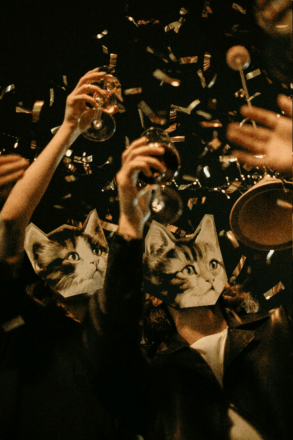 Cat headed people cheering.